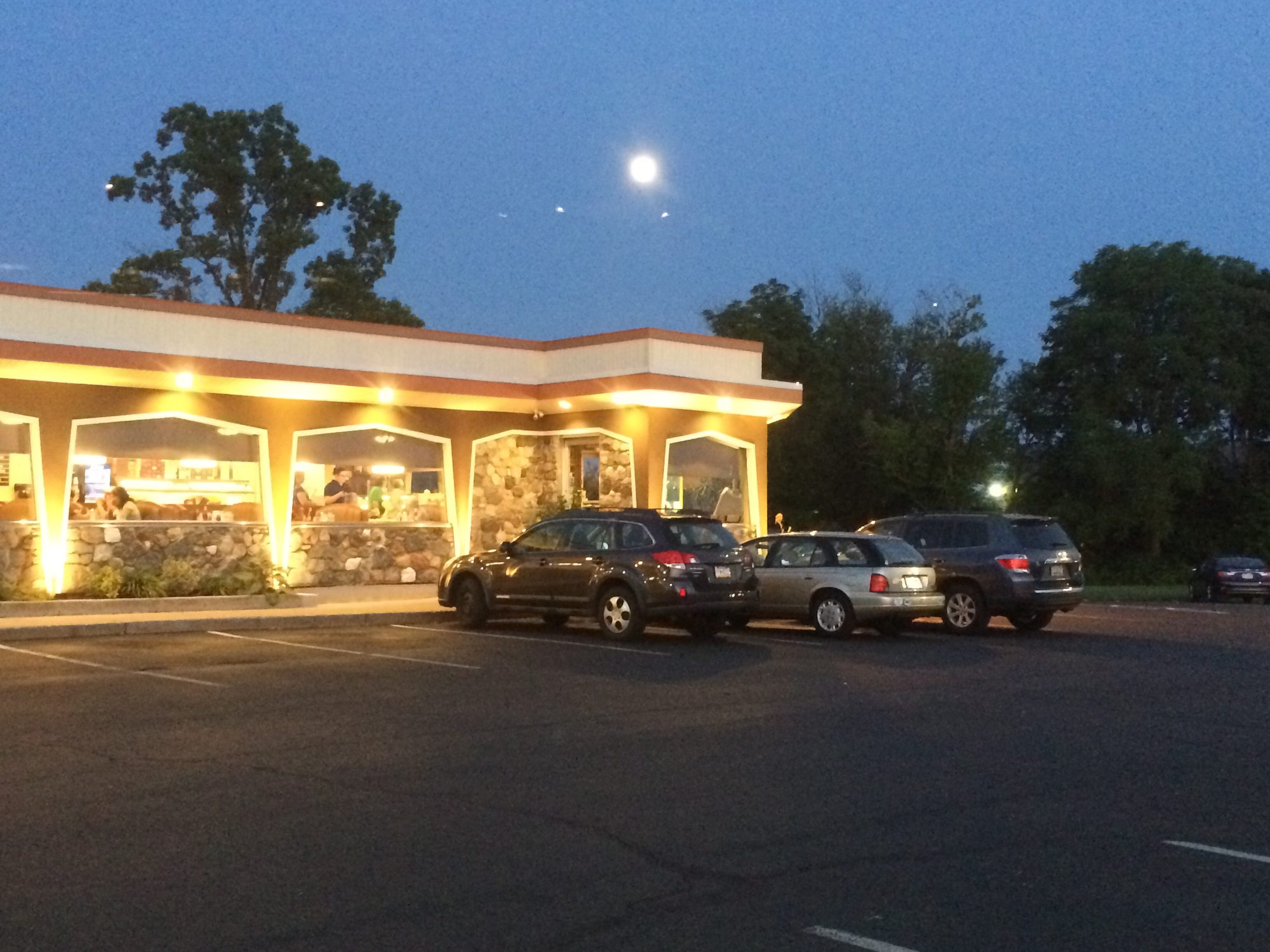 Lancers Diner lit up at dusk, seen from the parking lot on Easton Road
